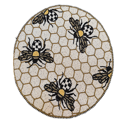 Round beaded placemat with a gold honeycomb pattern and five black and gold bee motifs.