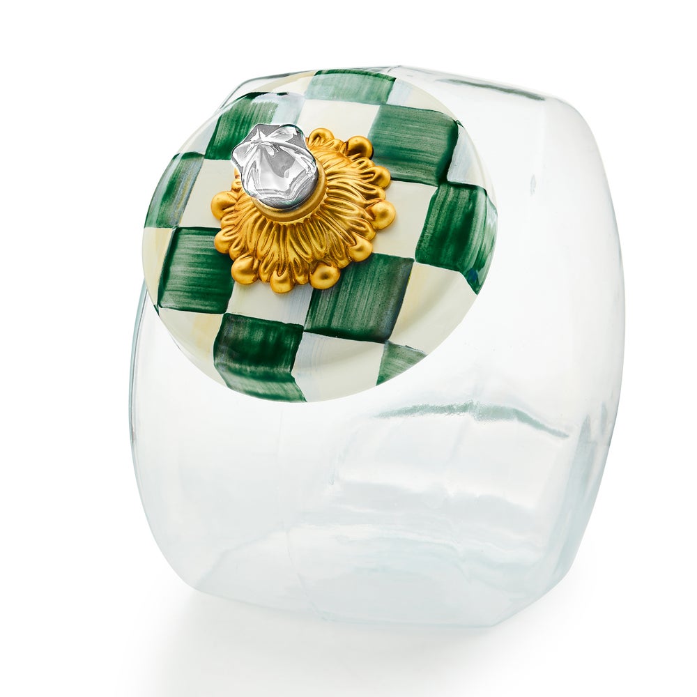 Glass cookie jar with emerald checkered lid featuring brass knob