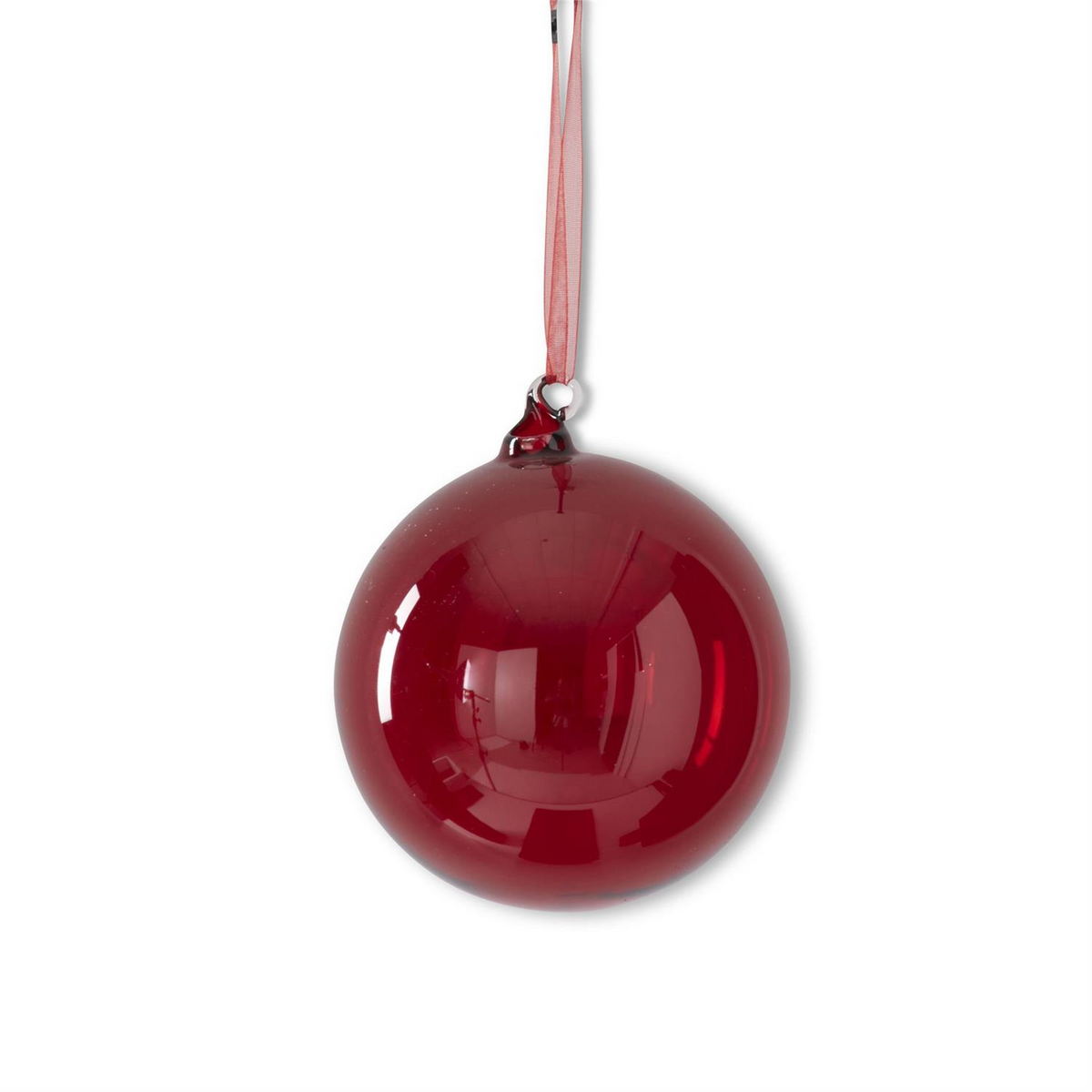 5.25 inch transparent red blown glass round ornament hanging from a red ribbon.
