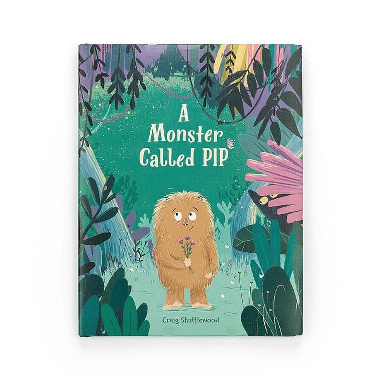 Hardcover children's book titled A Monster Called Pip featuring a cute green monster character on the cover.