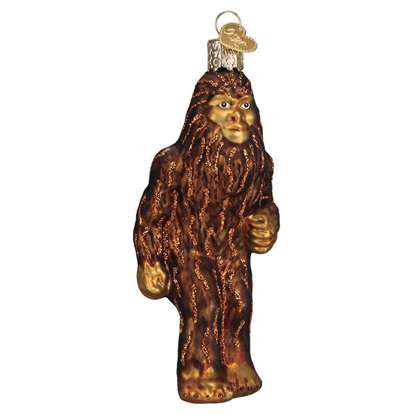 Glass Sasquatch Christmas ornament with brown glitter fur and a gold heart charm.