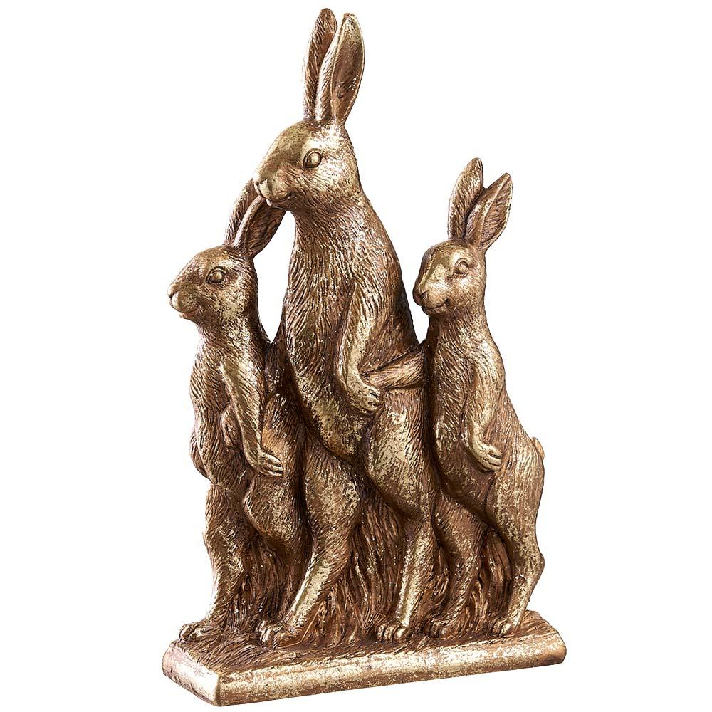 Gold resin bunny family figurine with four distinct silhouettes standing together.