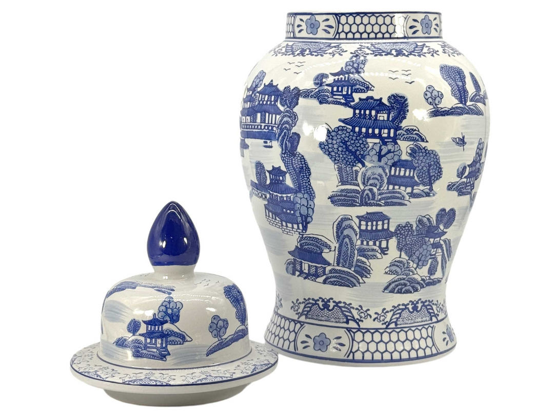 25-inch blue and white chinoiserie ceramic jar with lid featuring a traditional landscape scene.