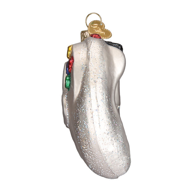 Side view of a silver glittery glass video game controller ornament with colorful buttons.