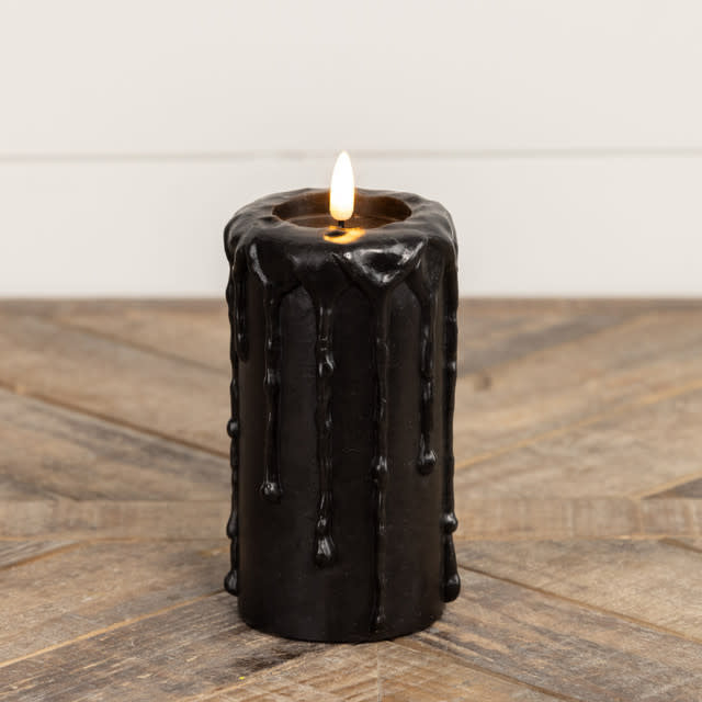 Black plastic pillar candle with realistic flickering flame effect