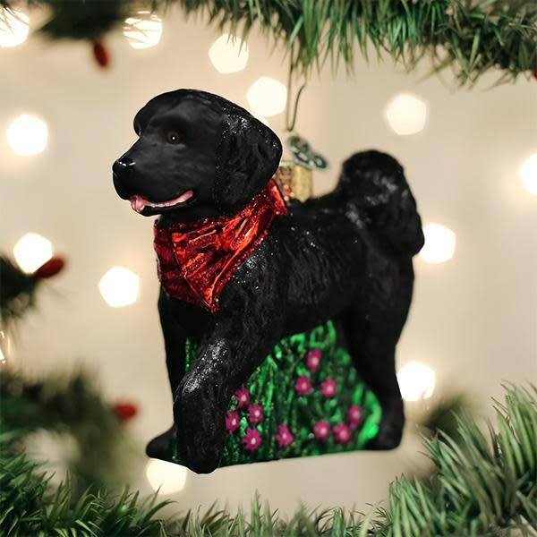 Black ceramic dog ornament shaped like a doodle with curly fur texture.
