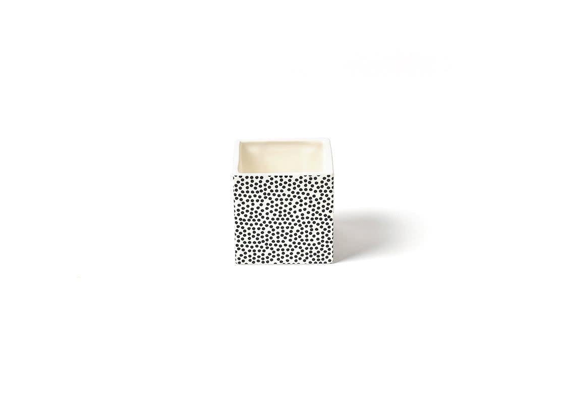 Small black ceramic nesting cube with white dot pattern holding potted succulents