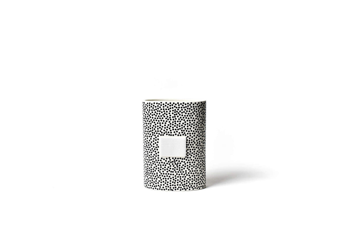 Black ceramic mini oval vase with small dot pattern on front