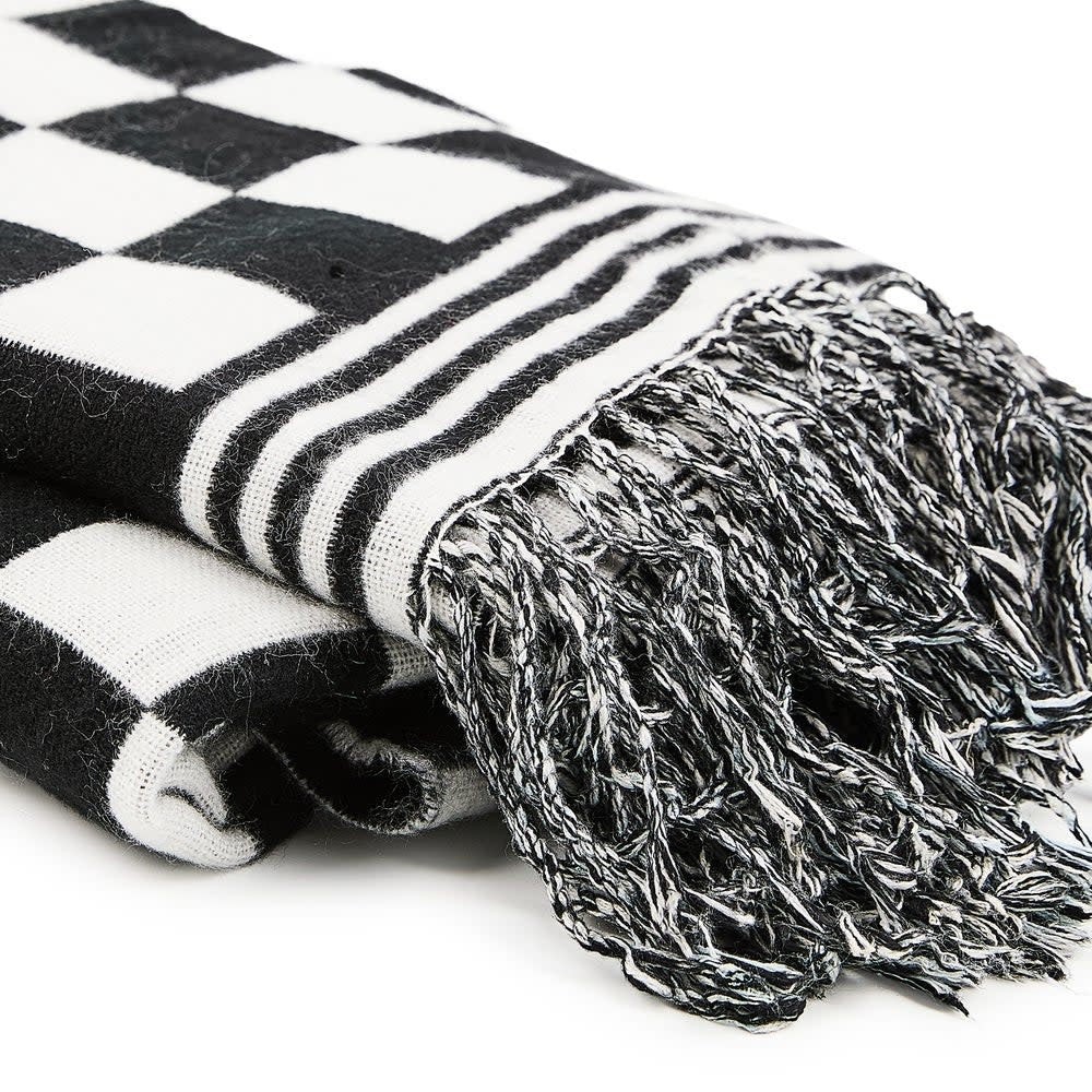 Acrylic black and white check throw blanket with a square shape.