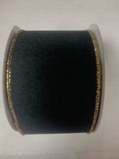 A roll of black ribbon with a subtle leopard print and gold glitter edges.