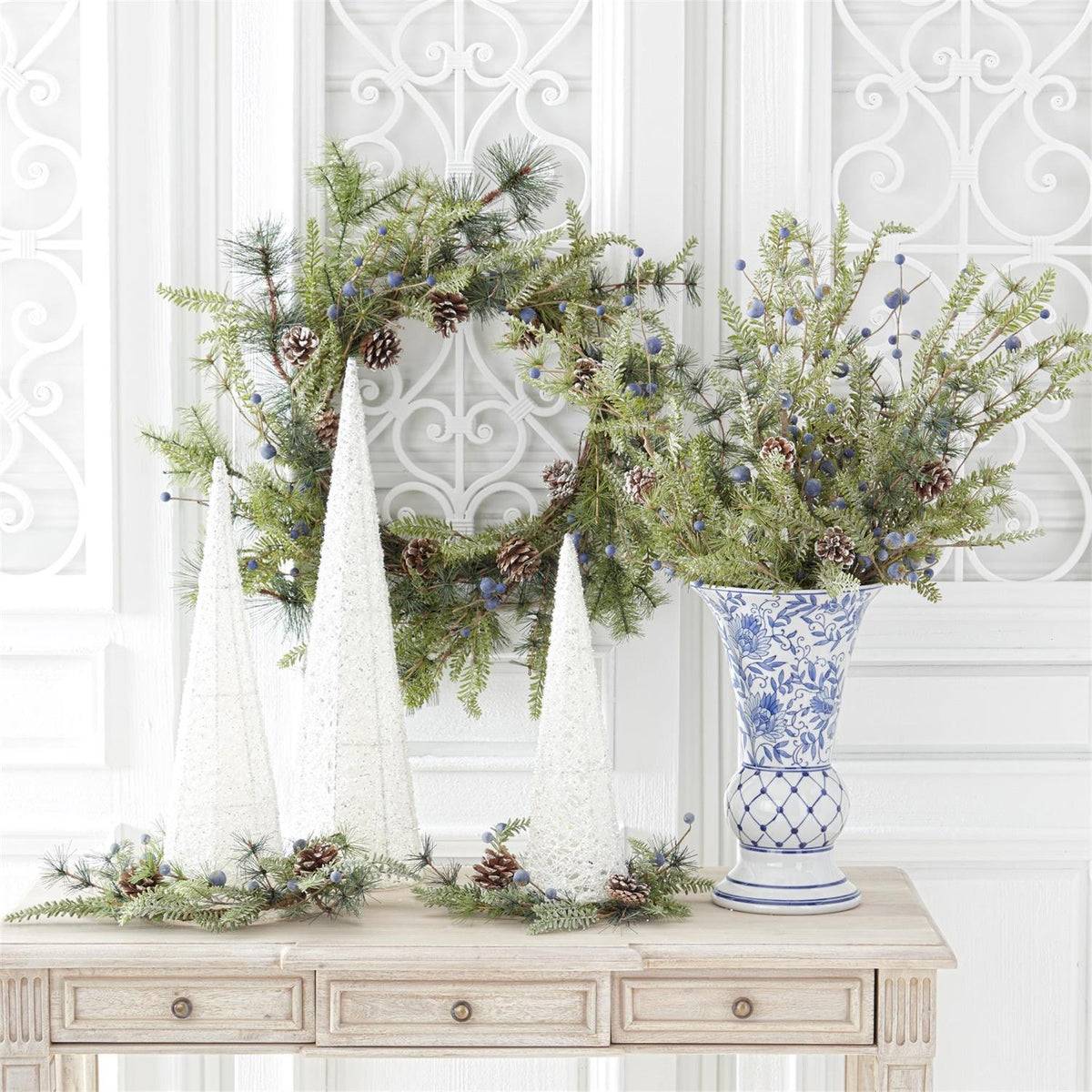 Blue and white fluted ceramic chinoiserie vase with a classic cylindrical silhouette.