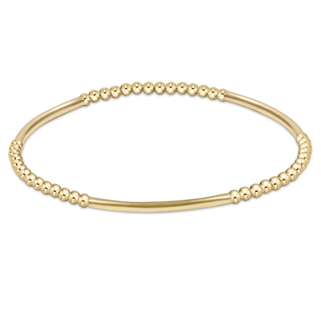 Gold-filled Bliss Bar bracelet with a geometric bead pattern on stretch elastic cord.