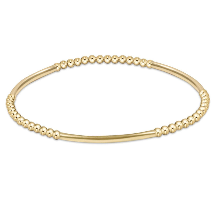 Gold-filled Bliss Bar bracelet with a geometric bead pattern on stretch elastic cord.