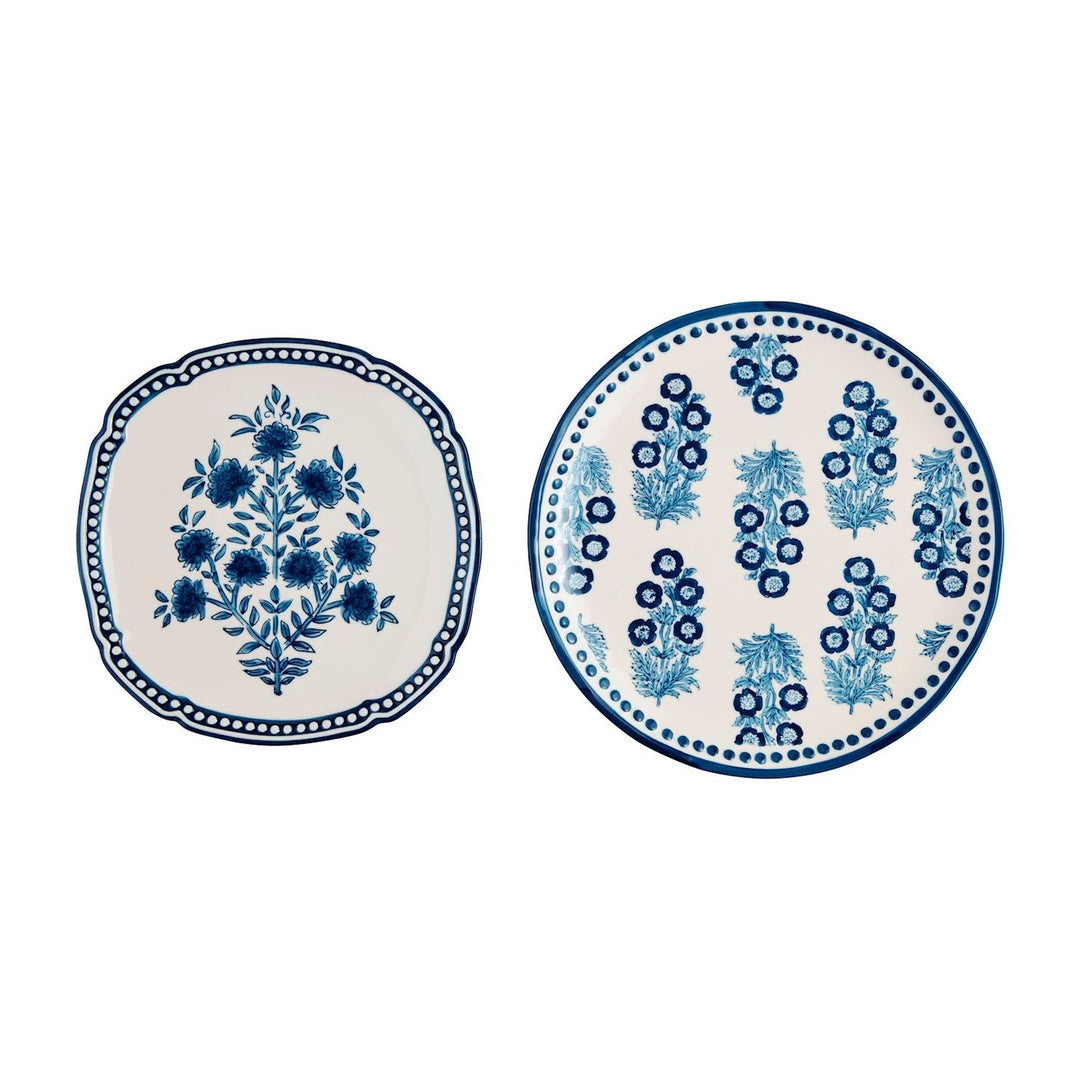Nested stoneware platters with hand-stamped block print patterns and painted rims.