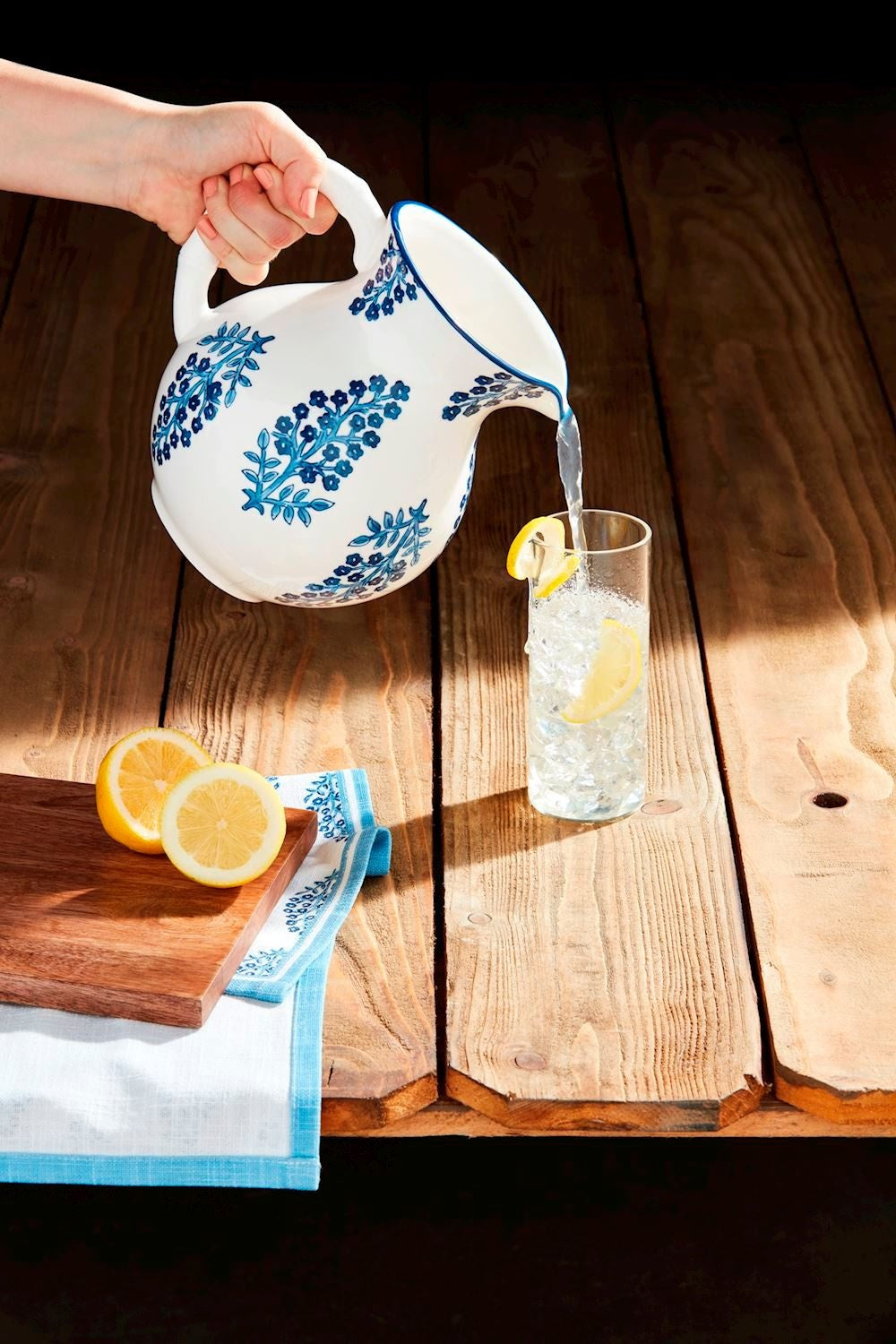 Hand-stamped stoneware pitcher with hand-painted rim in block print pattern.