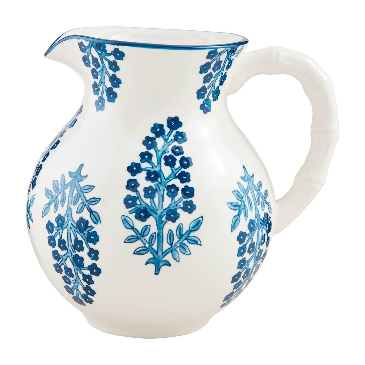 Hand-stamped stoneware pitcher with hand-painted rim in earthy block print pattern.