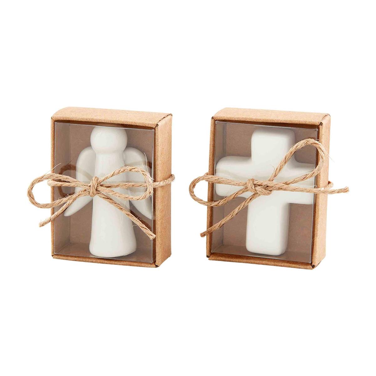 Two small brown gift boxes tied with twine, containing a white ceramic angel and a white cross.