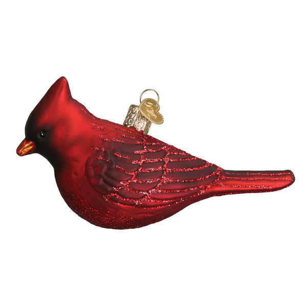 Glass Northern Cardinal ornament with red body, black mask, orange beak, white wing accents, and gold cap.