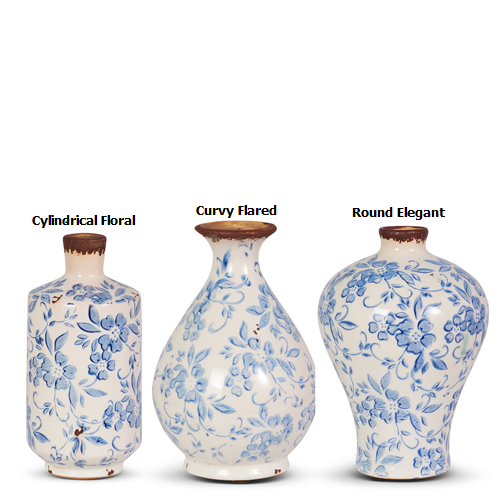 Terracotta bud vase with blue and white speckled glaze pattern.