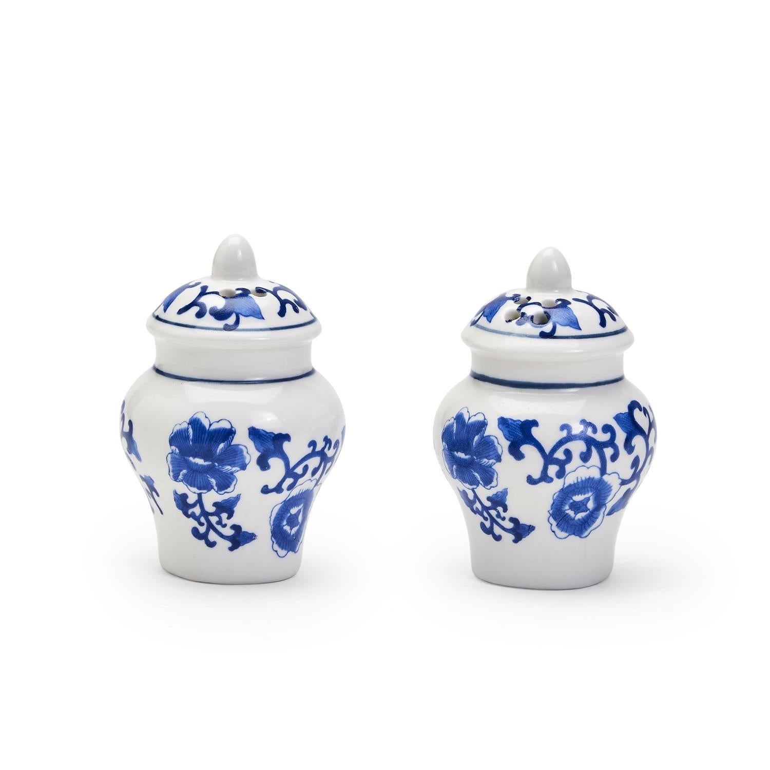 Ceramic salt and pepper shakers shaped as blue ginger jars with white floral patterns.