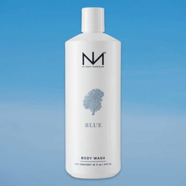 Blue body wash bottle with seaside fragrance label