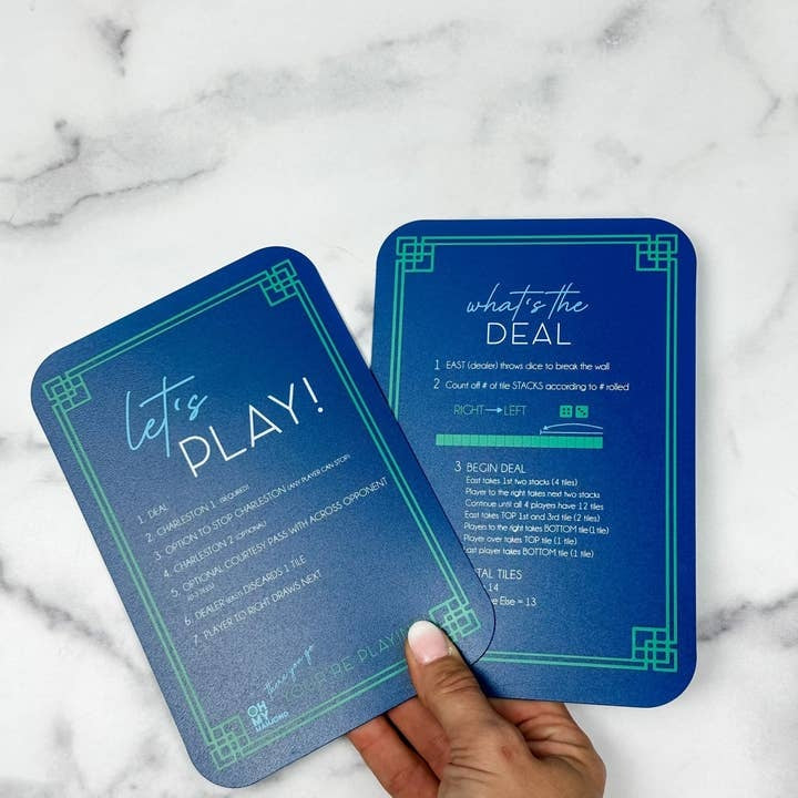 Blue plastic Mahjong tile shufflers with printed rules on sides