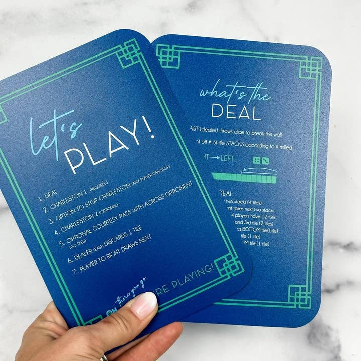 Blue plastic Mahjong tile shufflers with printed rules on sides