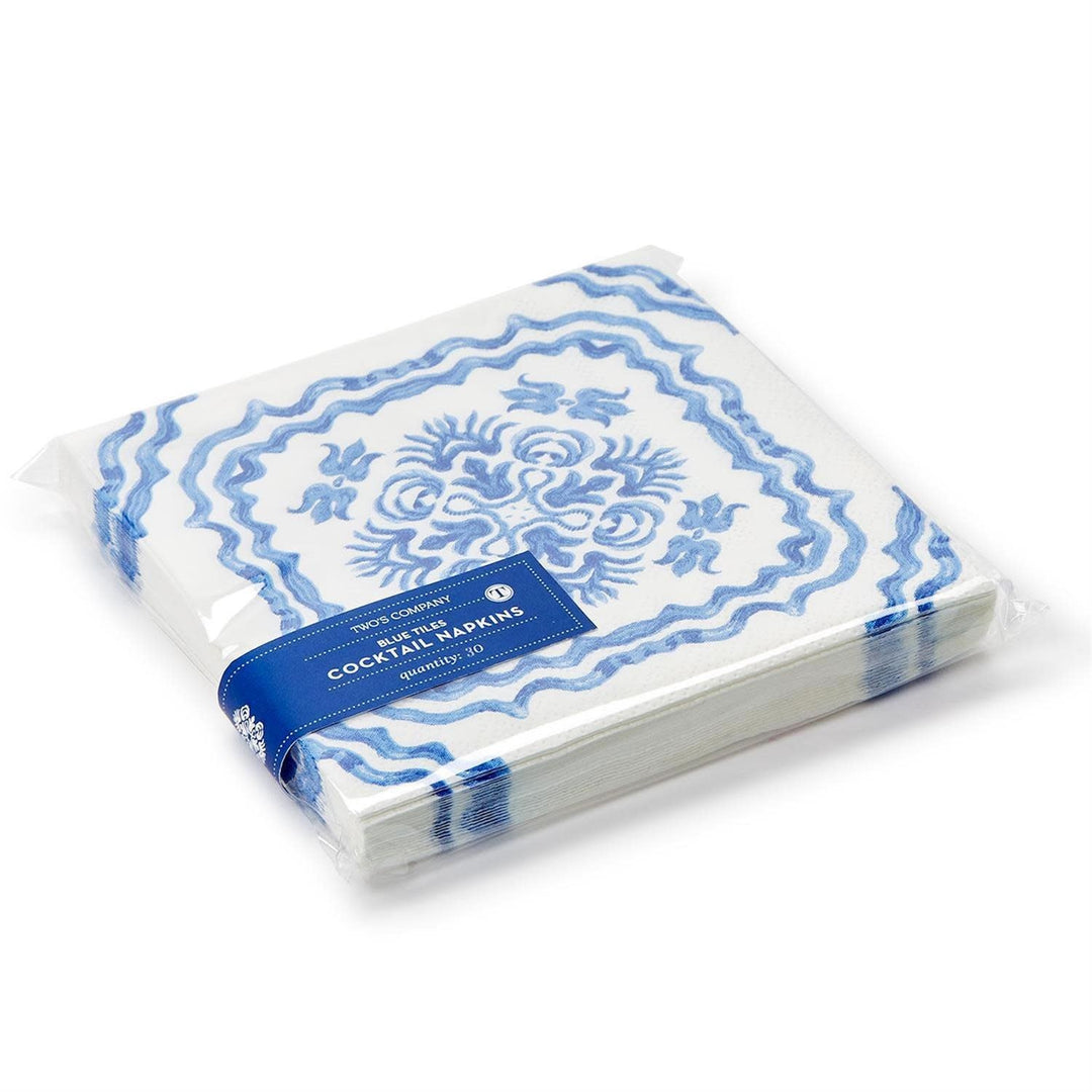 Blue tile block print cocktail napkin made of white paper with a Mediterranean coastal pattern.