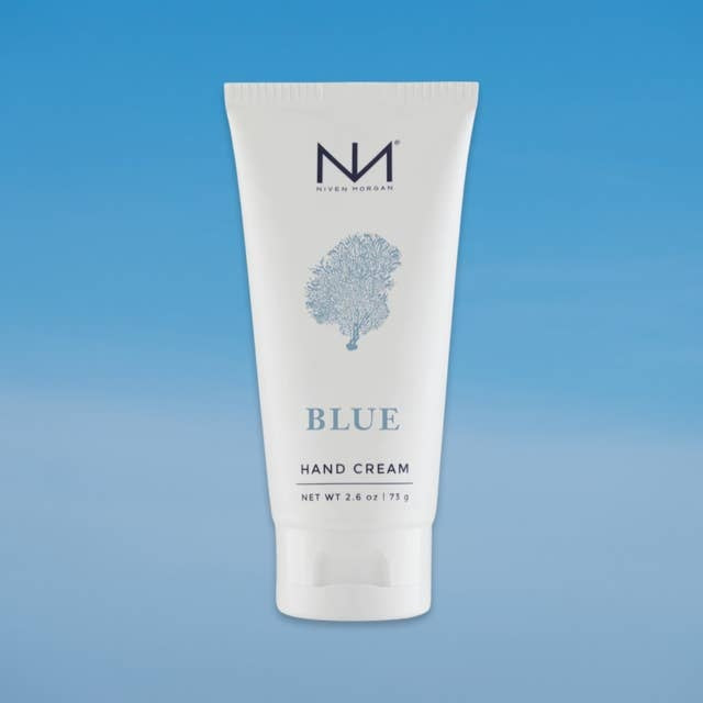 Blue travel hand cream tube with organic aloe vera and shea butter ingredients.
