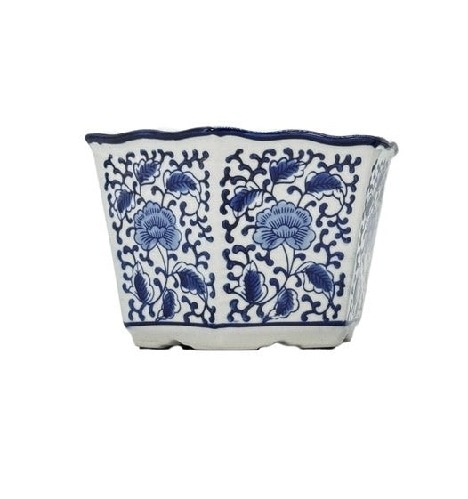 Blue and white hexagonal ceramic planter with floral pattern and ruffled lip rim