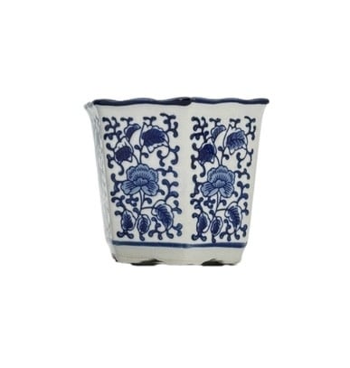 Blue and white hexagonal ceramic plant pot with floral pattern and ruffled lip rim
