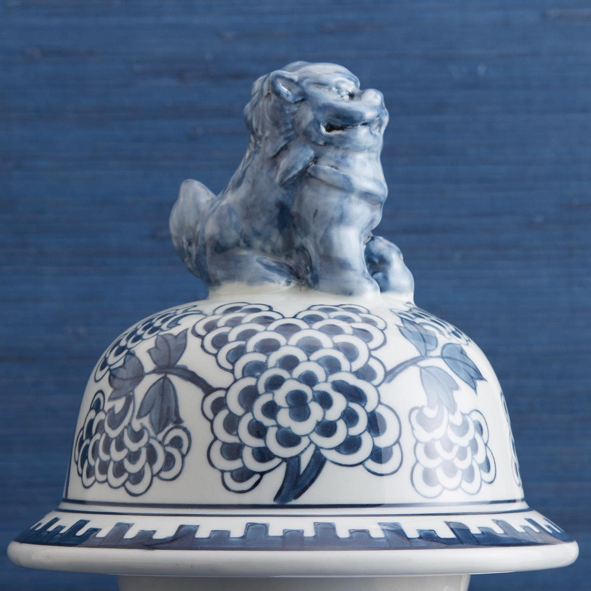 Hand-painted blue and white porcelain temple jar featuring traditional Chinese peony flower designs.
