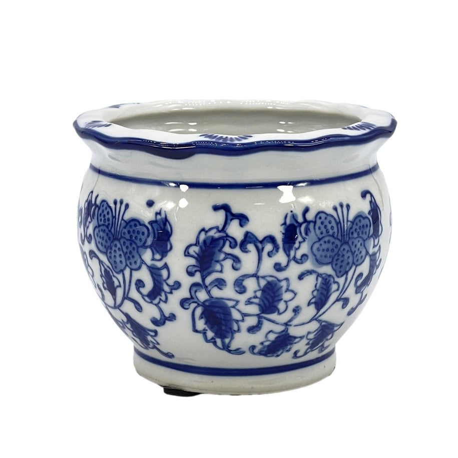 Round ceramic plant pot with blue and white floral pattern, ruffled lip rim