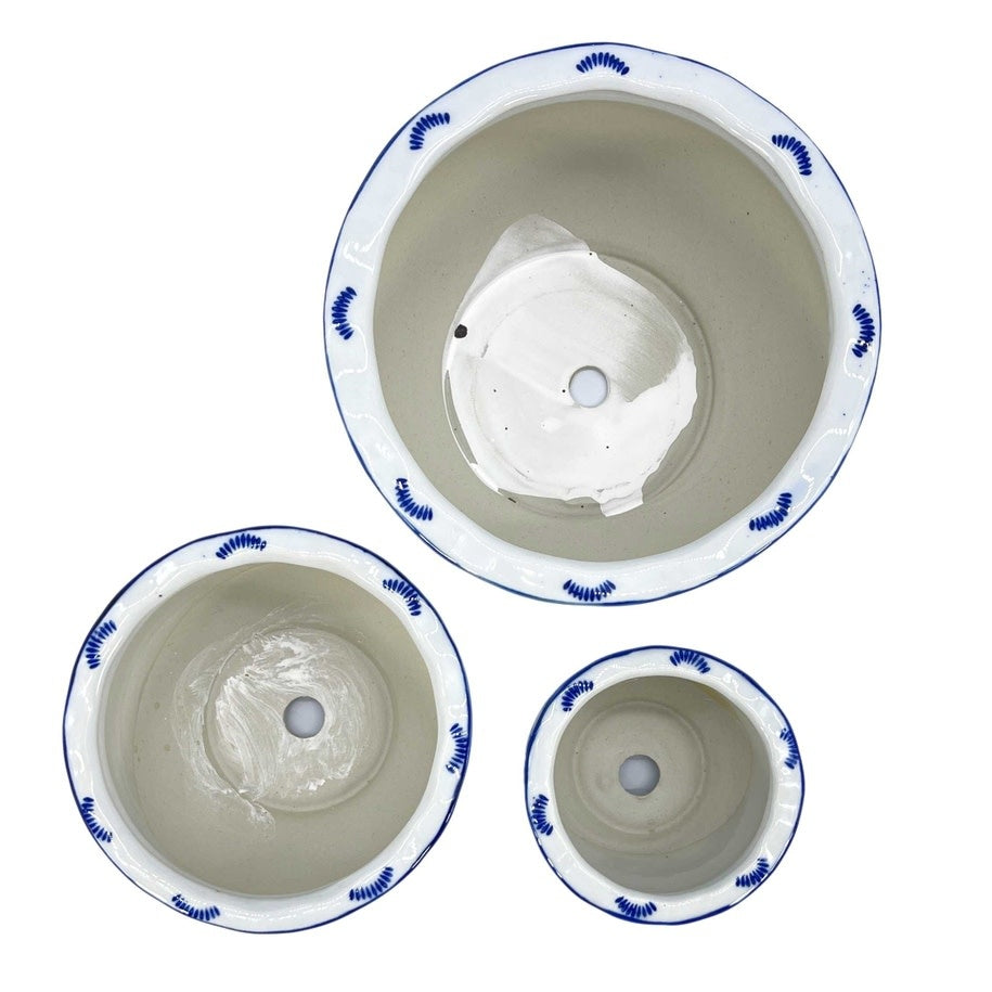 Round ceramic plant pot with blue and white floral pattern and ruffled lip edge