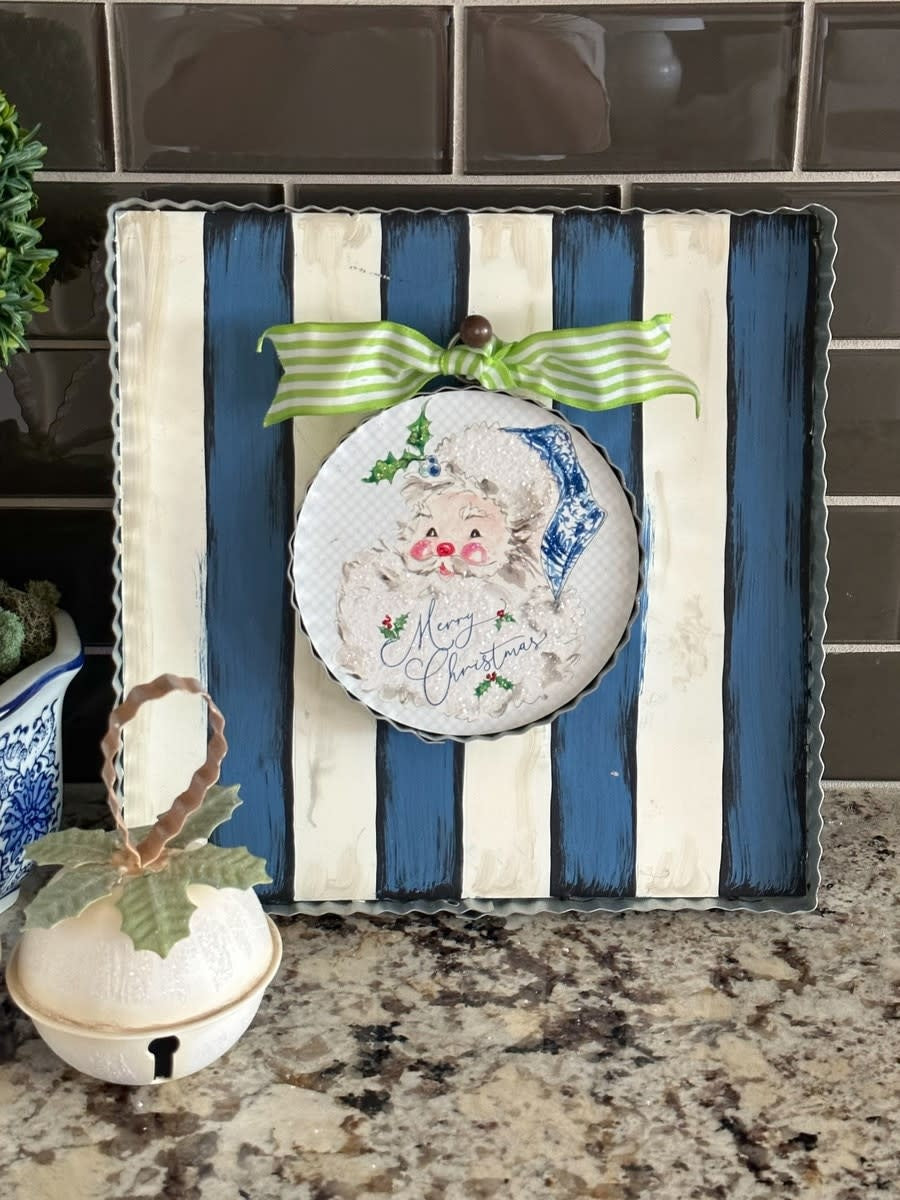 Metal mini gallery display board with blue and white vertical stripes.