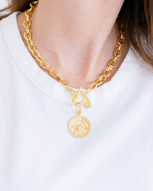 Blue Willow toggle necklace with triple-plated gold finish featuring a classic porcelain pattern plate charm.