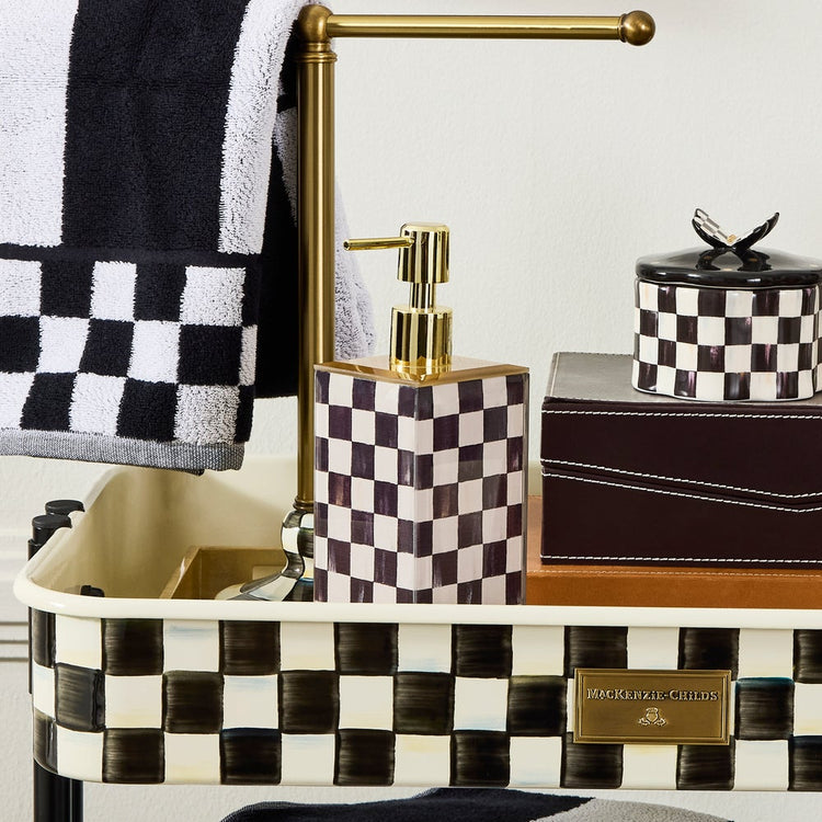 Courtly Check glass soap pump with printed blue checkered pattern on clear material.