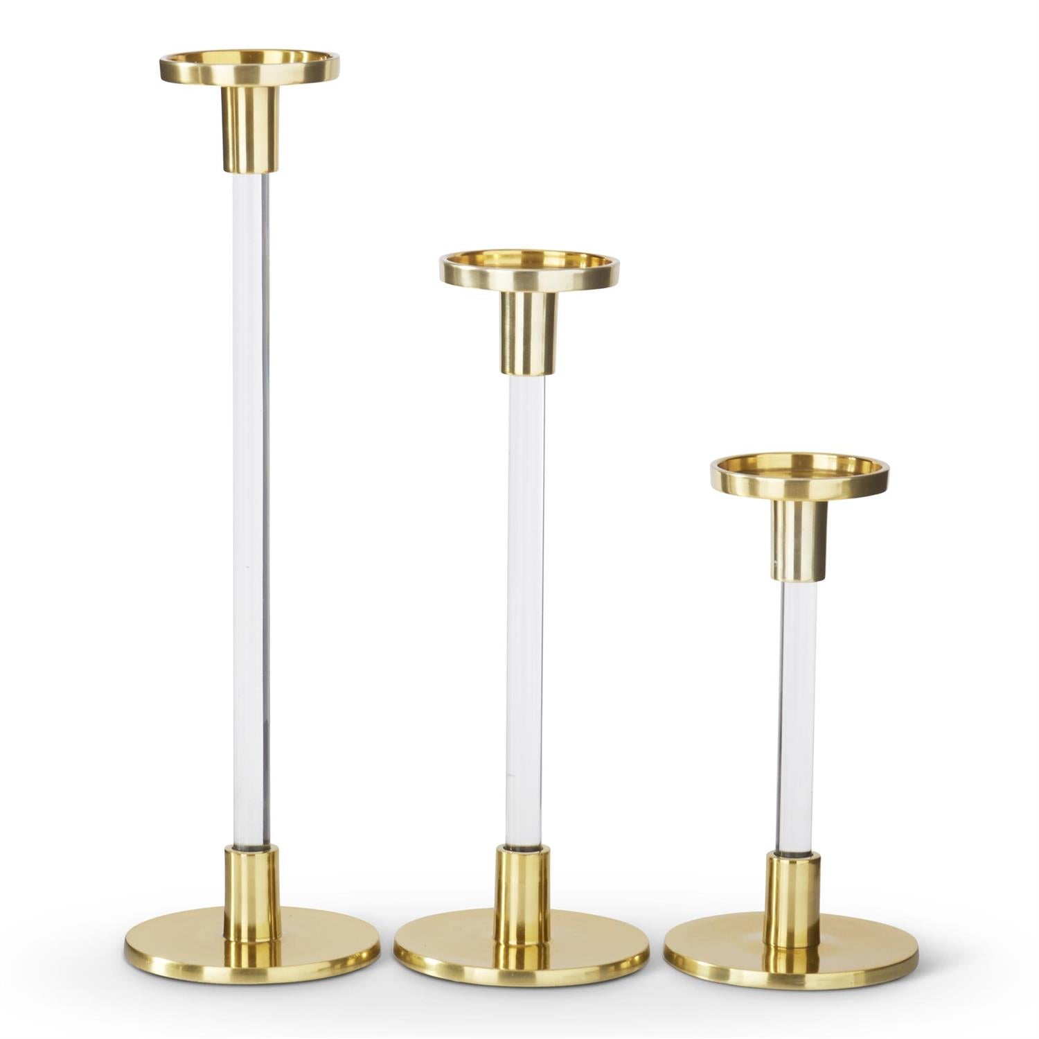 Set of three acrylic and gold metal taper candleholders in varying heights.