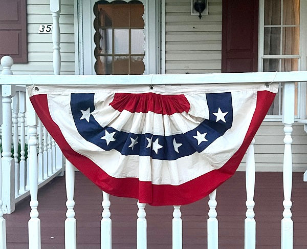 Vintage-style flag bunting measuring 18 by 36 inches with a classic triangular silhouette.