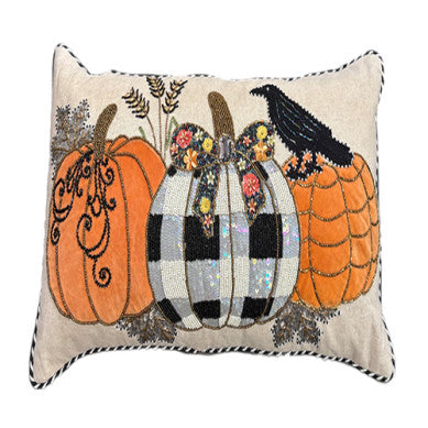 Pumpkin orange lumbar throw pillow with a black crow graphic on a neutral background.