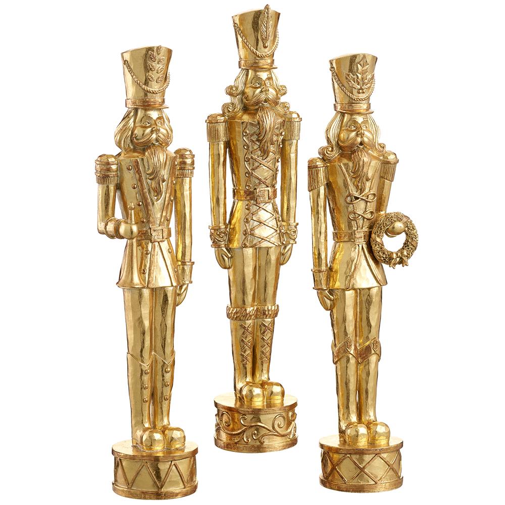 Gold resin nutcracker figurine with a classic soldier silhouette.