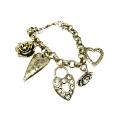 Antique gold adjustable bracelet featuring five chunky charms with a length range from .75 to 2.5 inches.