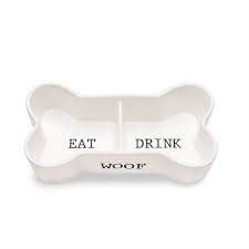 Ceramic dog bowl shaped like a bone with embossed WOOF text and divided eat drink wells