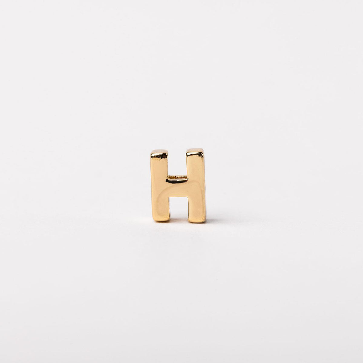 Charm Luxe bar necklace in gold-tone metal with a delicate pendant silhouette.
