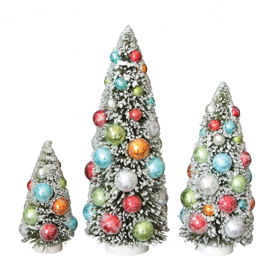 Multicolor bottle brush Christmas tree figurine with ornaments on a wood base.