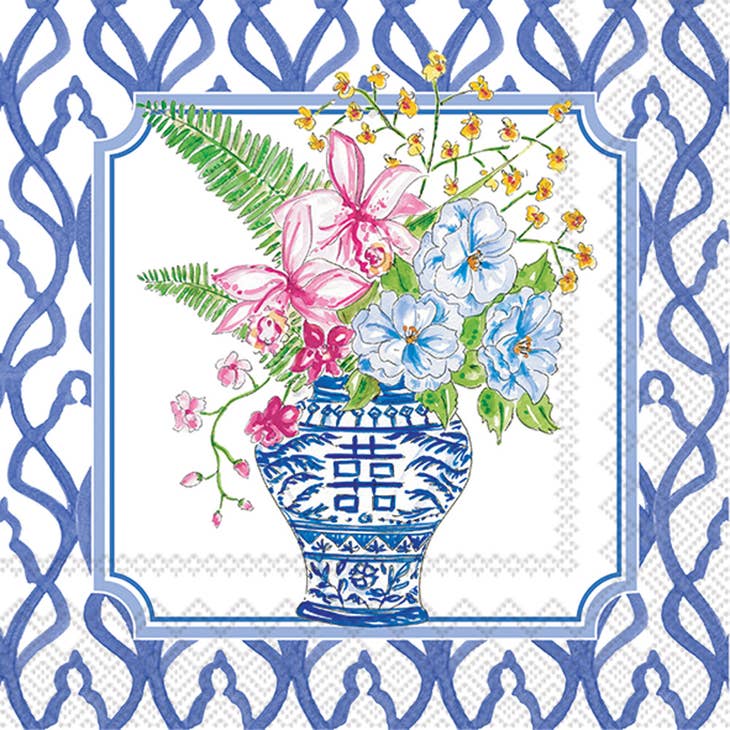Blue and white chinoiserie vase with pink and blue flowers and green ferns on a white background with a blue lattice border.