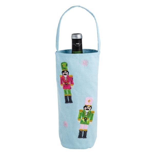 Canvas wine bag with sequin nutcracker icons in red and gold tones