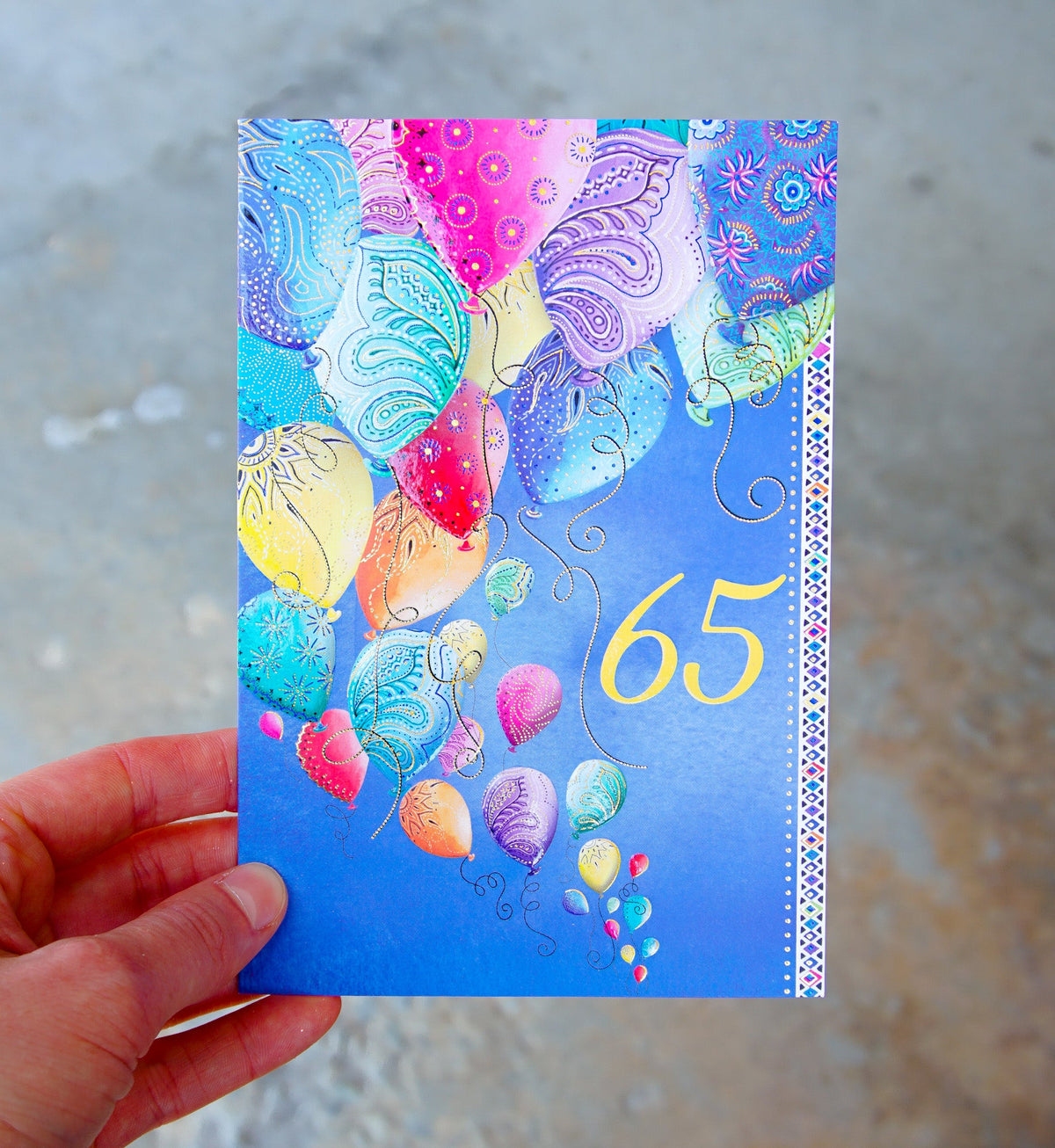 Two Twenty Two foil birthday card with embossed text reading '65' inside and 'and getting better every year!' outside.