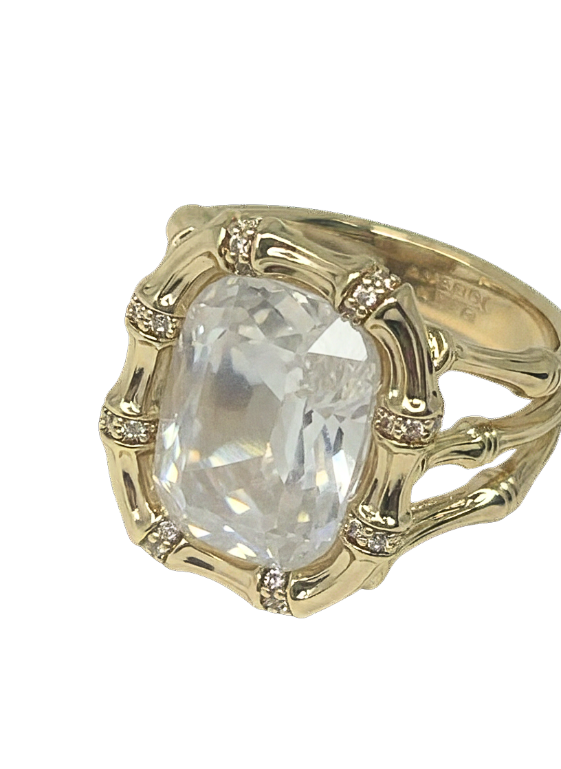 18K gold dipped bronze bamboo ring featuring a large clear gemstone and pavé crystal accents.