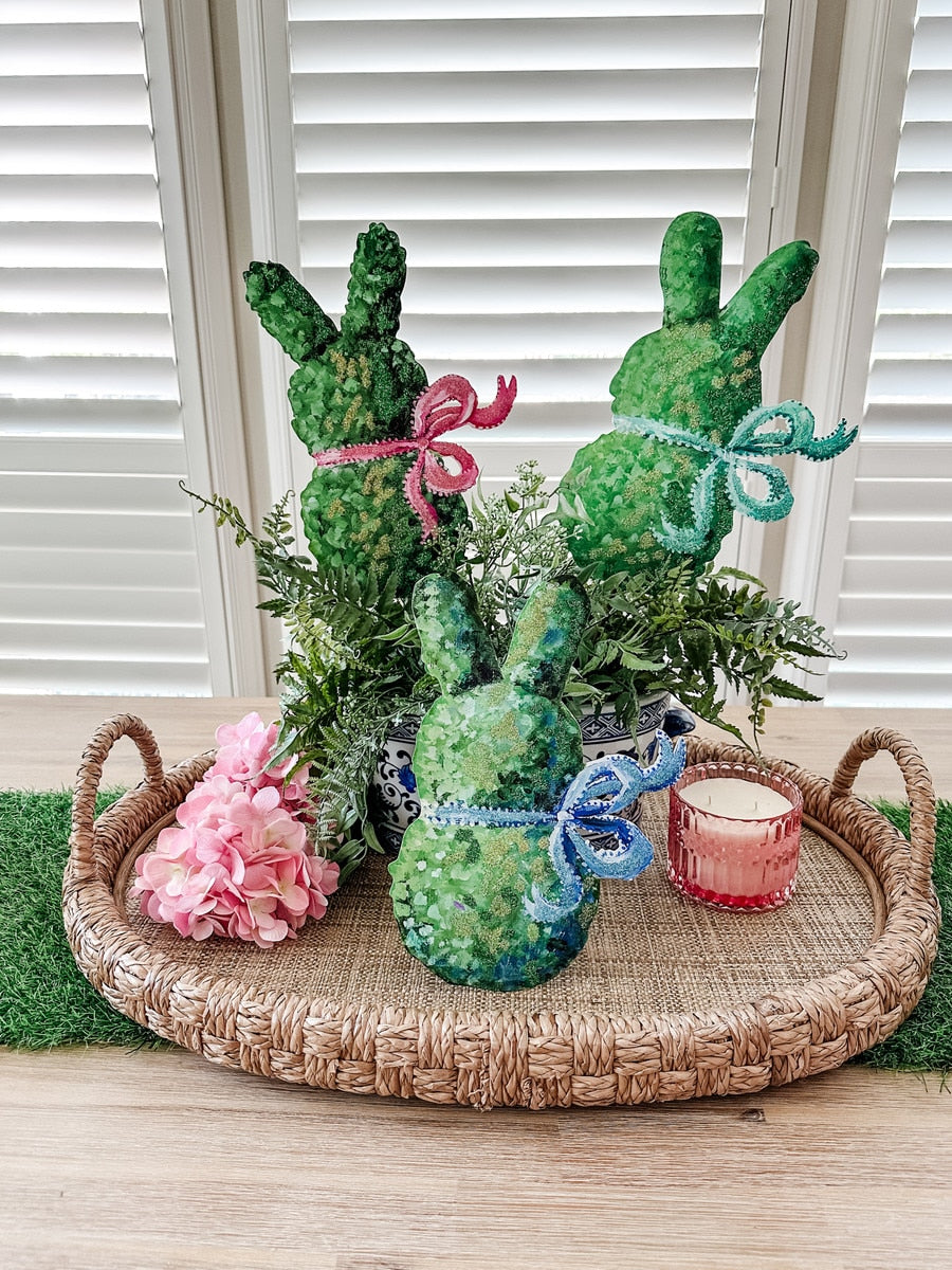 Boxwood bunny planter shaped like a rabbit with green foliage ears.